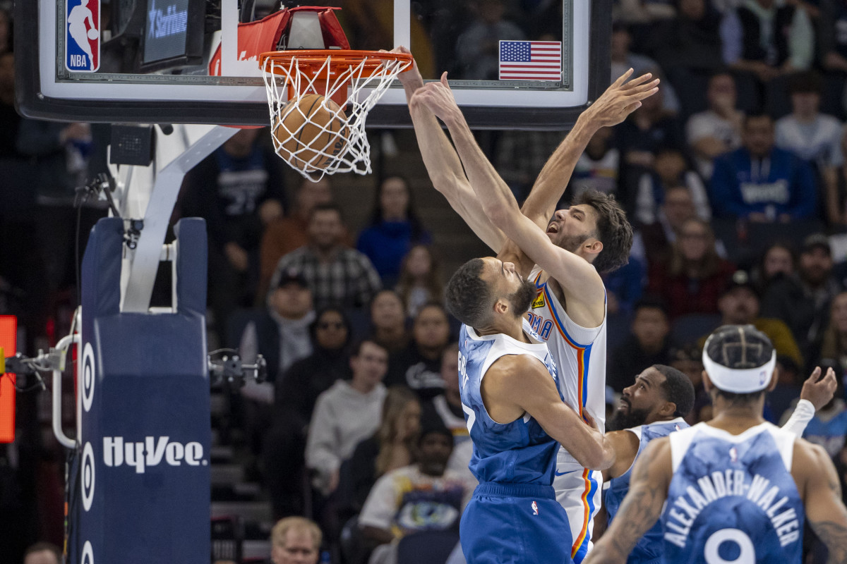 Nov 28, 2023; Minneapolis, Minnesota, USA; Oklahoma City Thunder forward Chet Holmgren (7) dunks over Minnesota Timberwolves center Rudy Gobert (27) in the second half at Target Center. Mandatory Credit: Jesse Johnson-USA TODAY Sports